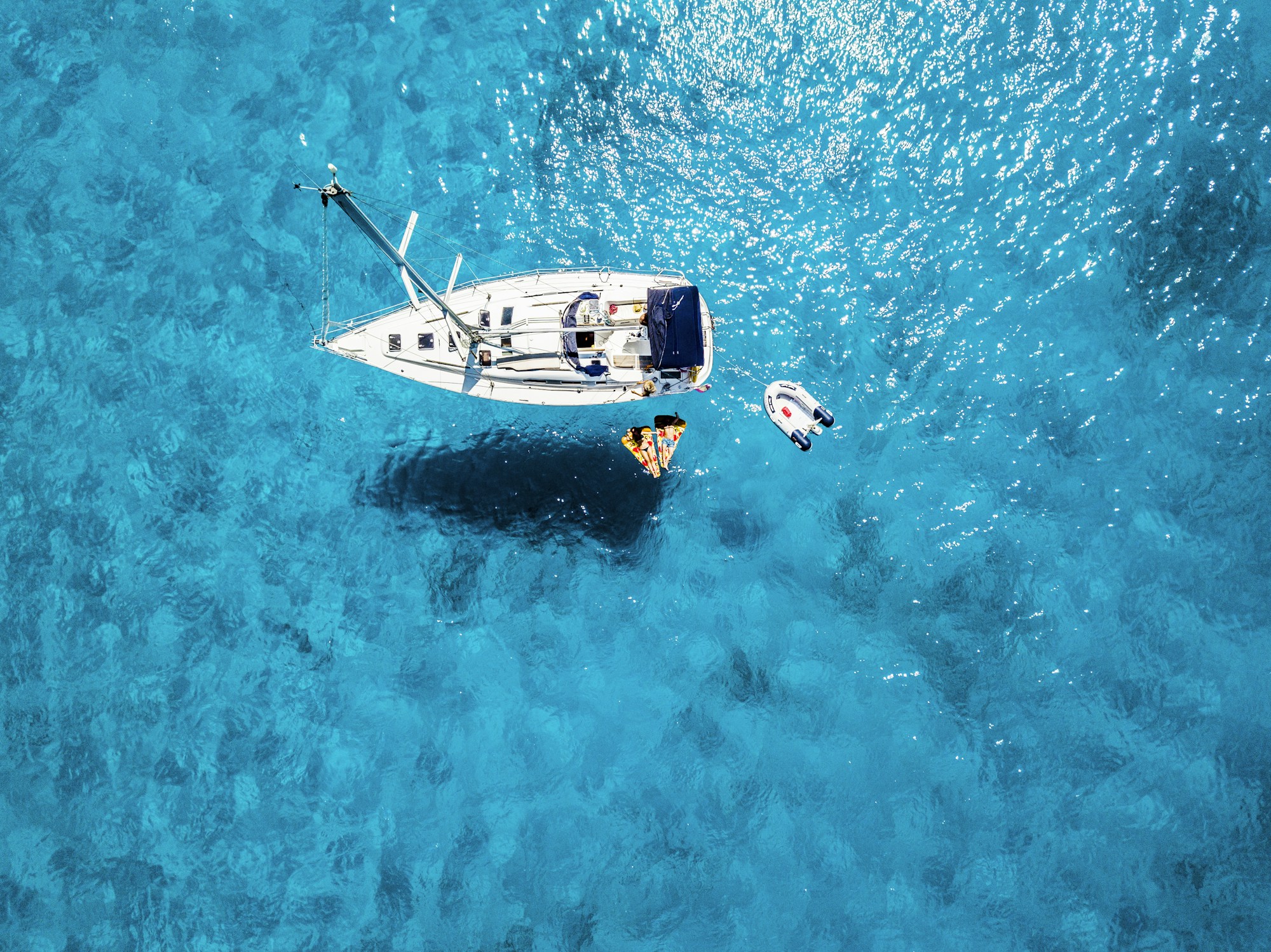 Yacht on calm blue water